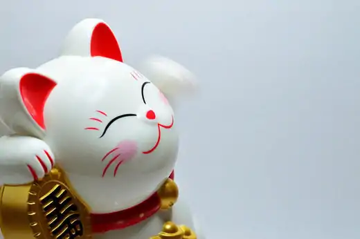 Maneki Neko, The Chinese lucky cat sit | charm and amulet